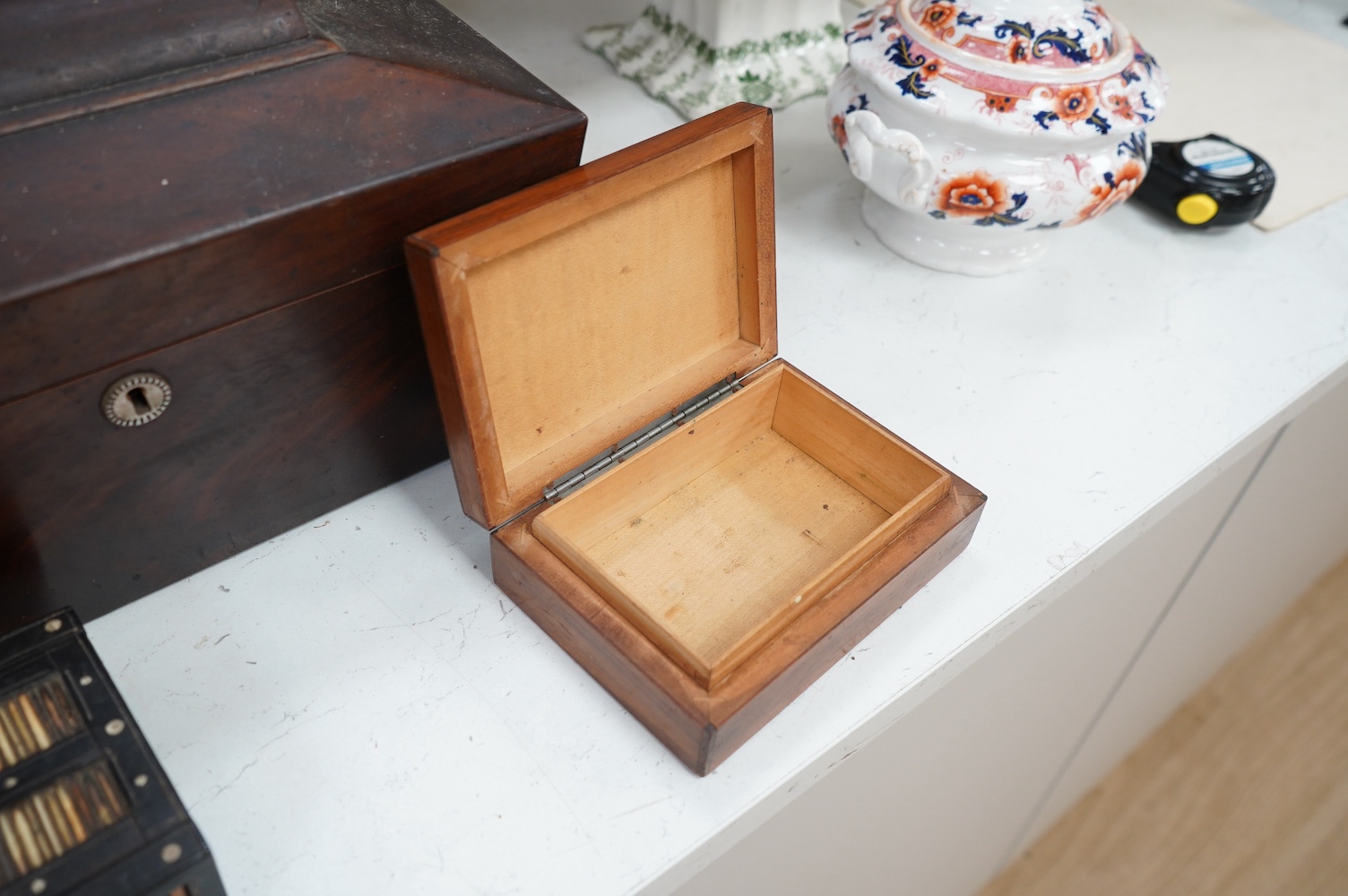 Six 19th century and later boxes to include a writing box, tea caddy, quill box and a jewellery box in the form of books with mirrored interior, largest 35cm wide. Condition - varies